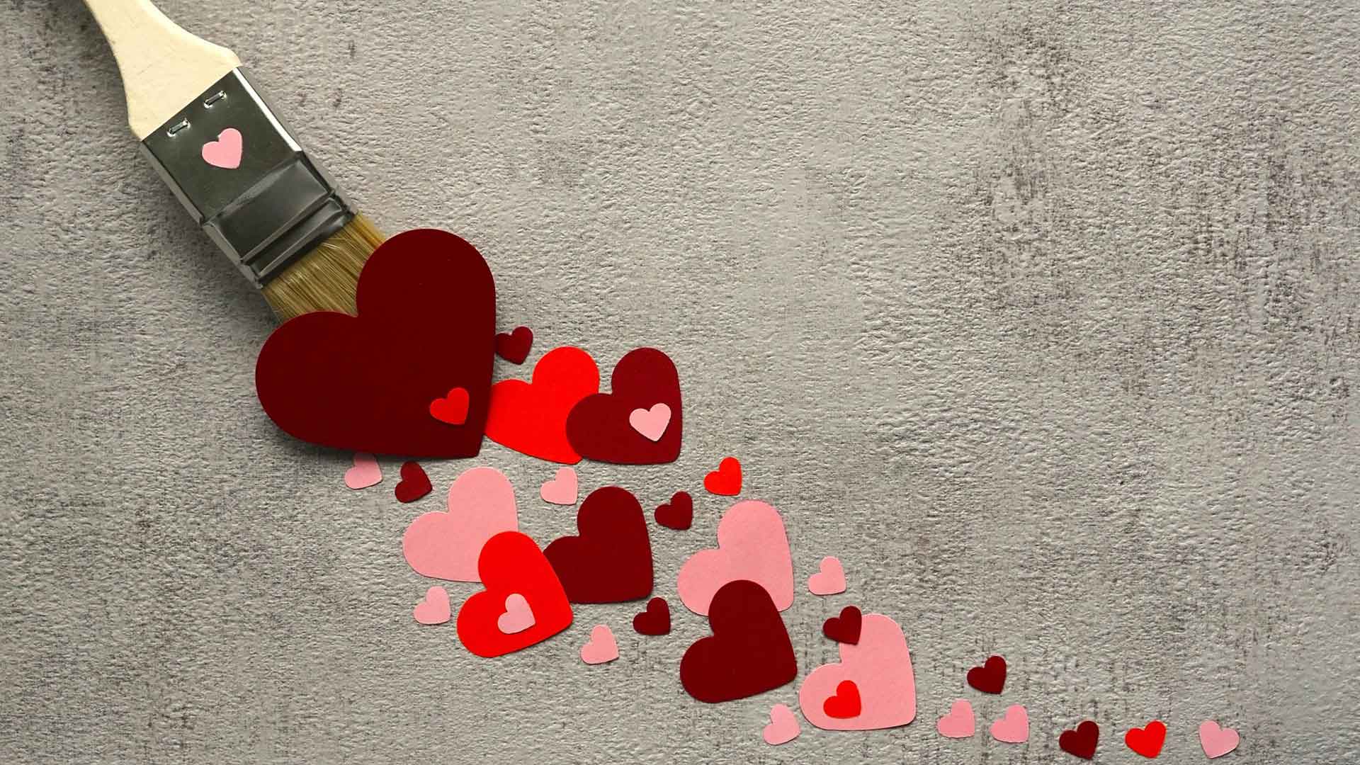 Emotionaler Ballast loswerden, kleine Herzen von einem Pinsel gestrichen